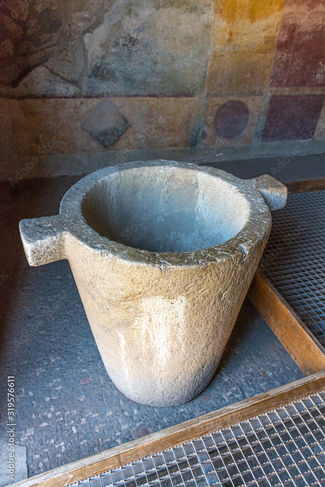 Italy, Pompeii, archaeological area, remains of the city buried by the eruption of ashes and rocks of Vesuvius in 79. Details of a grocery store Italy, Pompeii, archaeological area, remains of the city buried by the eruption of ashes and rocks of Vesuvius in 79. Details of a grocery store