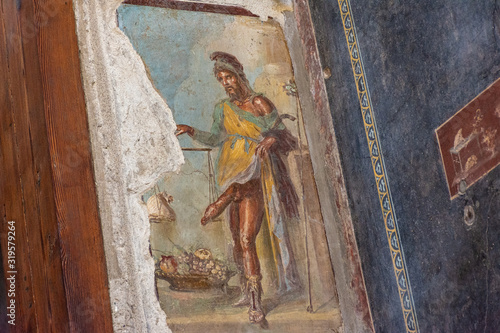 Italy, Pompeii, archaeological area, remains of the city buried by the eruption of ashes and rocks of Vesuvius in 79.  Fresco of Priapus