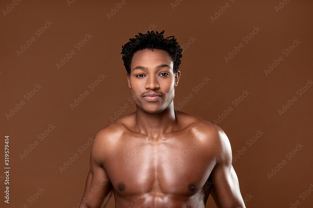 Fit african man looking at camera. Fit african man looking at camera.