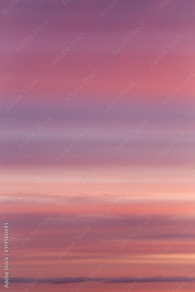Dramatic soft sunrise, sunset pink violet sky with clouds background texture	