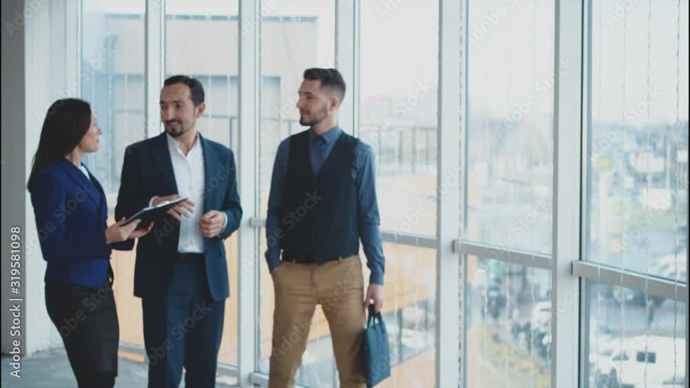 Male business workers are discussing issues. Copy space. Successful agreement. Secretary brings documents for signature. Blurred. Close up. 4K. Male business workers are discussing issues. Copy space. Successful agreement. Secretary brings documents for signature. Blurred. Close up. 4K.