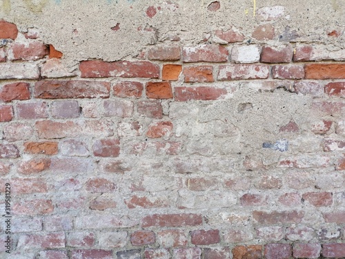 Mattoni di un muro antico che mostra i mattoncini