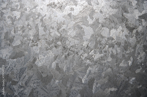 High resolution photograph of a weathered galvanized steel surface.