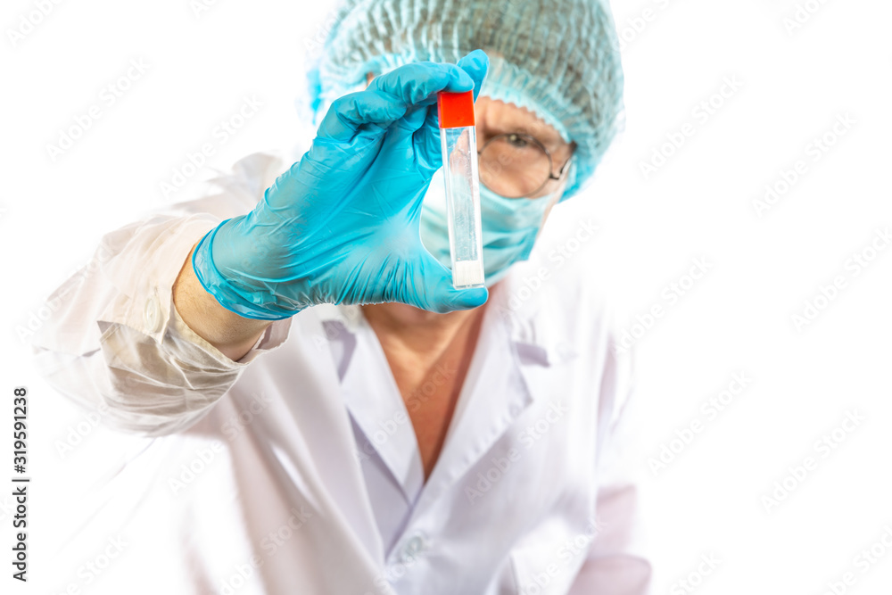 lab technician looks at a test tube of clear liquid, coronavirus lab technician looks at a test tube of clear liquid, coronavirus