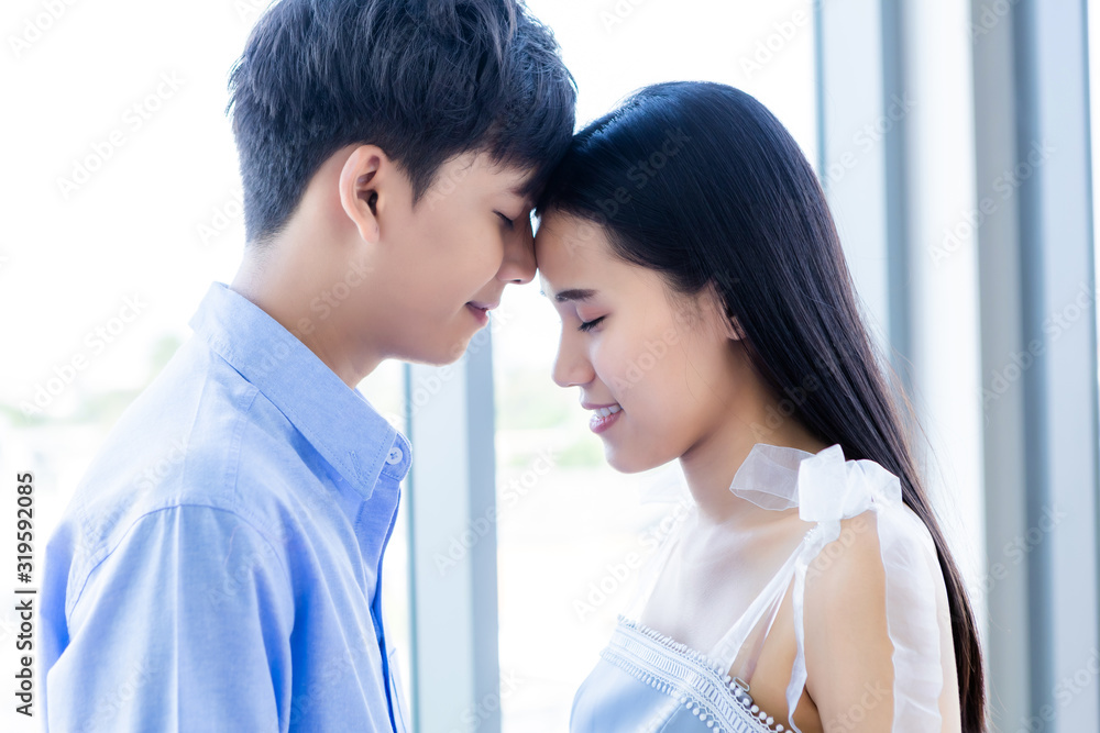 Valentine's day concept,portrait of asian Young happy couple face to face kissing at home background Valentine's day concept,portrait of asian Young happy couple face to face kissing at home background