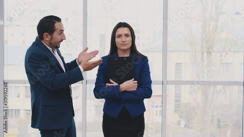 Calm businesswoman is holding forder. Worker is asking for salary, on blurred light background. Give me more money Close up. Copy space. Animation. 4K. photo