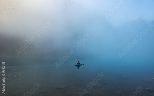 Misty morning kayak on the calm lake