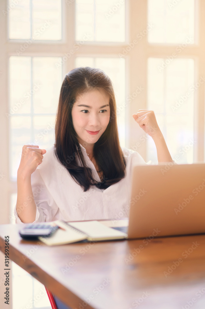 Asian business woman success celebration at office, success happy pose. E-commerce, internet technology, or startup small business concept. Asian business woman success celebration at office, success happy pose. E-commerce, internet technology, or startup small business concept.