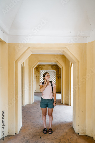 young woman in a historic building