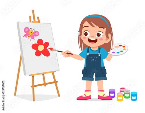 happy cute little kid girl draw on canvas