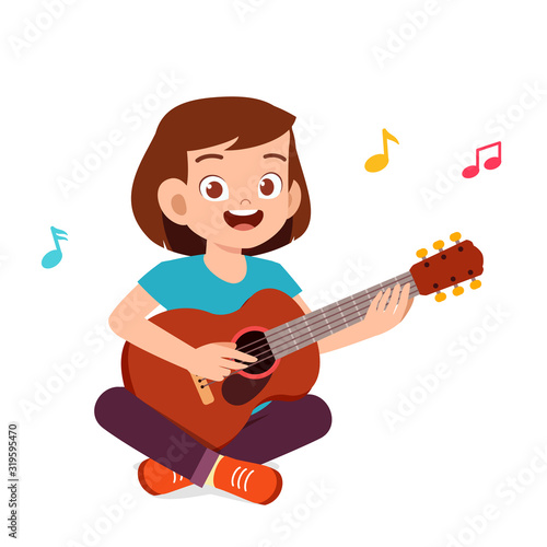 happy cute little teen girl play guitar