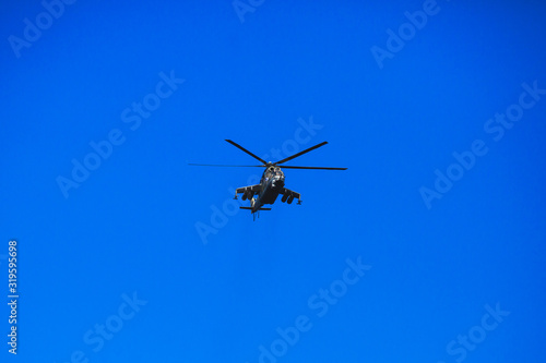 Fototapeta Naklejka Na Ścianę i Meble -  Russian military helicopter during flight in the air, a squadron formation of helicopters
