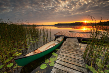 Papier peint photo Pantone 2025 Mocha Mousse Beautiful summer sunrise over lake  © Piotr Krzeslak
