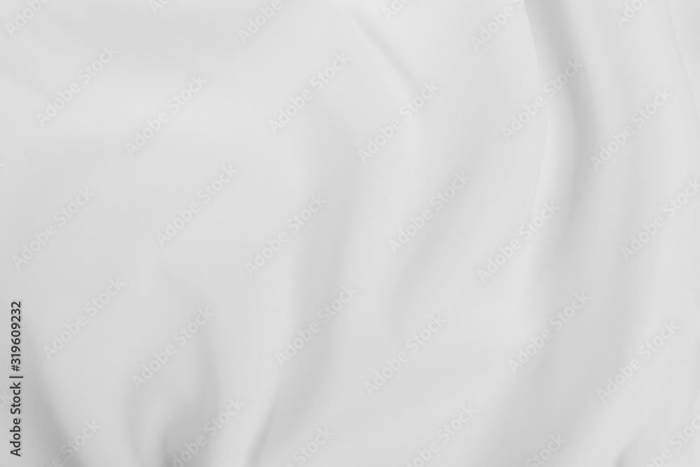 Abstract white fabric texture background. Cloth soft wave. Creases of satin, silk, and cotton.	