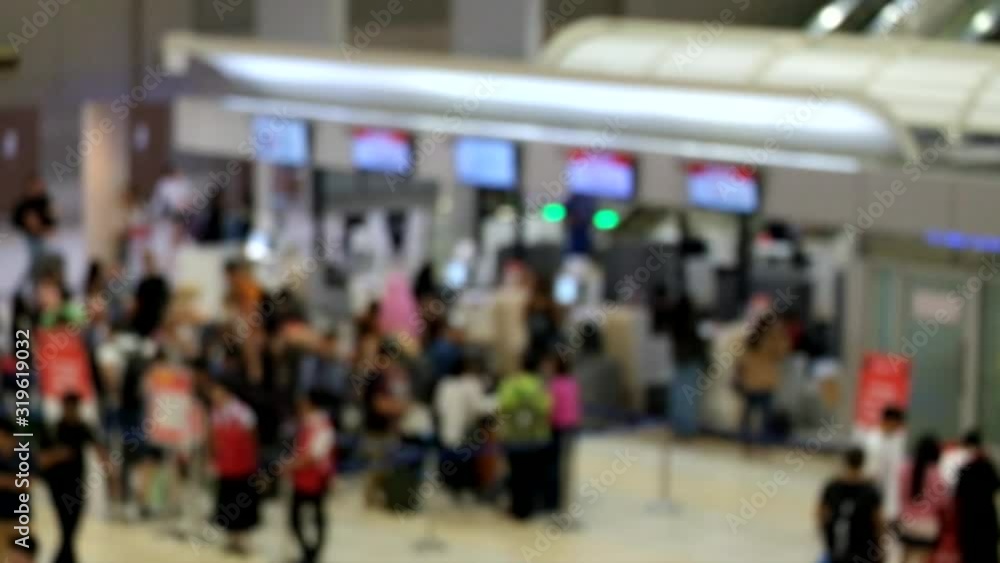 Blurred and unrecognizable people are waiting to check in at the airport. Blurred and unrecognizable people are waiting to check in at the airport.