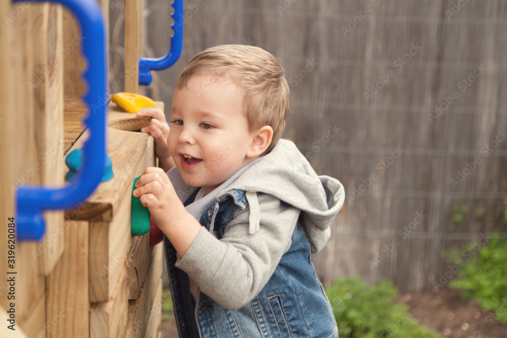 Toddler climbing outdoor cubby backyard Toddler climbing outdoor cubby backyard