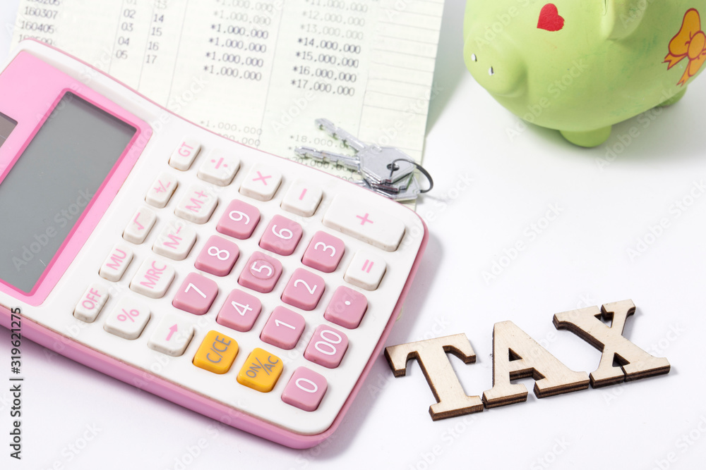 Calculator and bankbook and TAX word and key Calculator and bankbook and TAX word and key