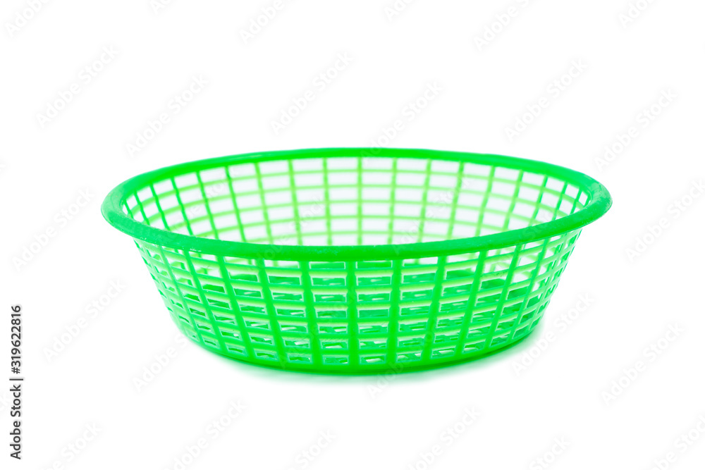 Green plastic basket on a white background Green plastic basket on a white background