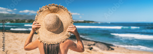Summer beach vacation panoramic young woman with straw hat on Caribbean destination getaway sun holiday travel banner panorama.