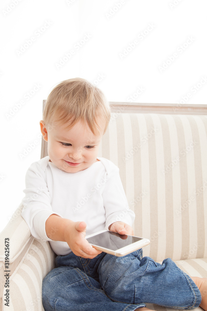 Baby with smart phone, toddler white background 