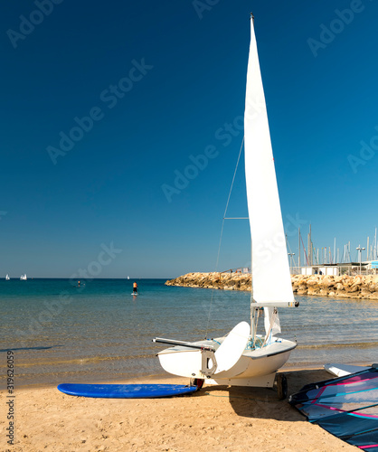 Winter morning and water sport on central public beach of the Mediterranean S...