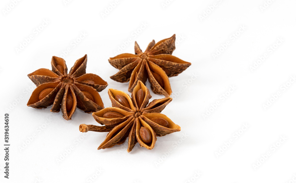 Three dried anise spice stars on a white background Three dried anise spice stars on a white background