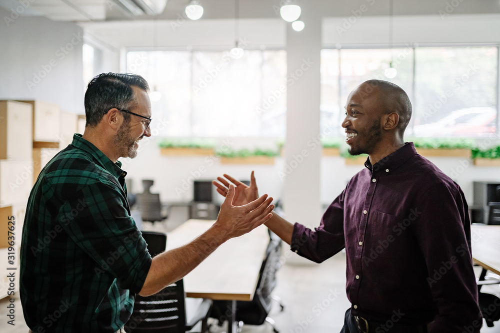 © JonoErasmus - Two diverse businessmen friends about shake hands smiling and greeting. Happy to meet © JonoErasmus - Two diverse businessmen friends about shake hands smiling and greeting. Happy to meet