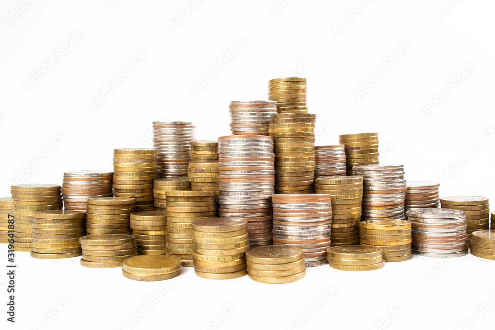 Many monetary coins lie and stand in columns depicting monetary wealth. Many monetary coins lie and stand in columns depicting monetary wealth.