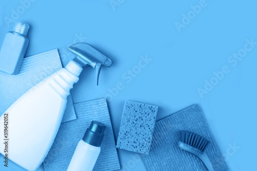 House cleaning products are on blue background. Cleaning concept.