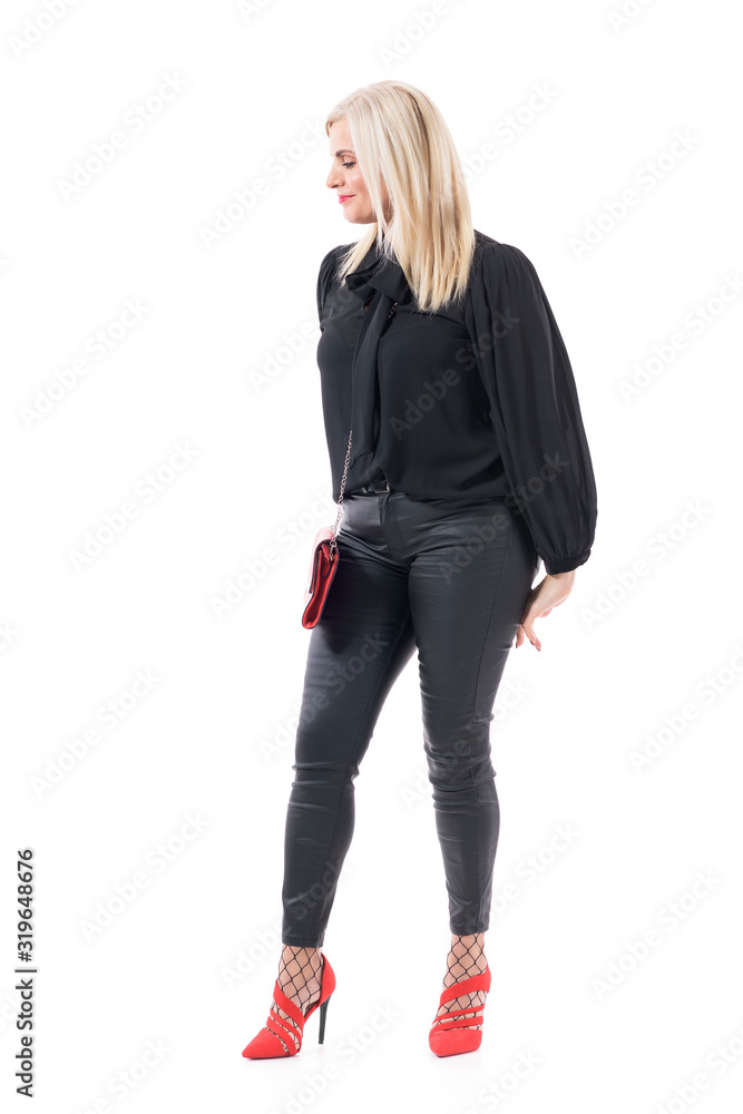 Side view of happy smiling complimented well dressed mid age woman looking away blushing. Full body portrait isolated on white background. Side view of happy smiling complimented well dressed mid age woman looking away blushing. Full body portrait isolated on white background.