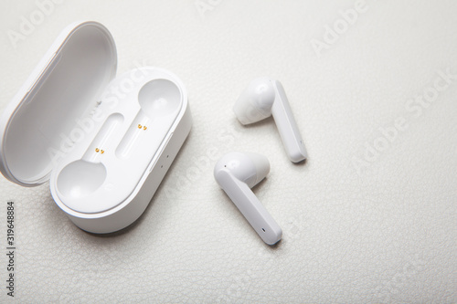 earphones case white leather background