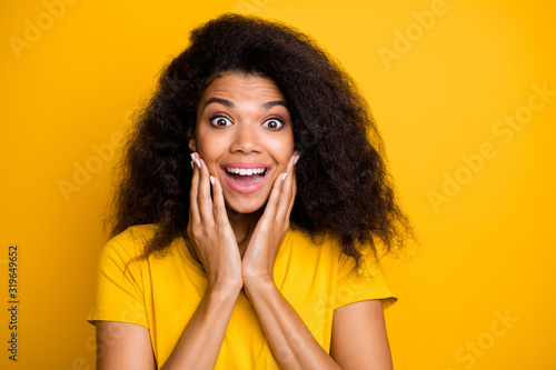 Close-up portrait of nice attractive lovely cheerful cheery amazed delighted wavy-haired girl got good news isolated on bright vivid shine vibrant yellow color background