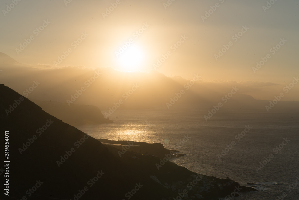 soft warm sunset on ocean in north side Tenerife island.