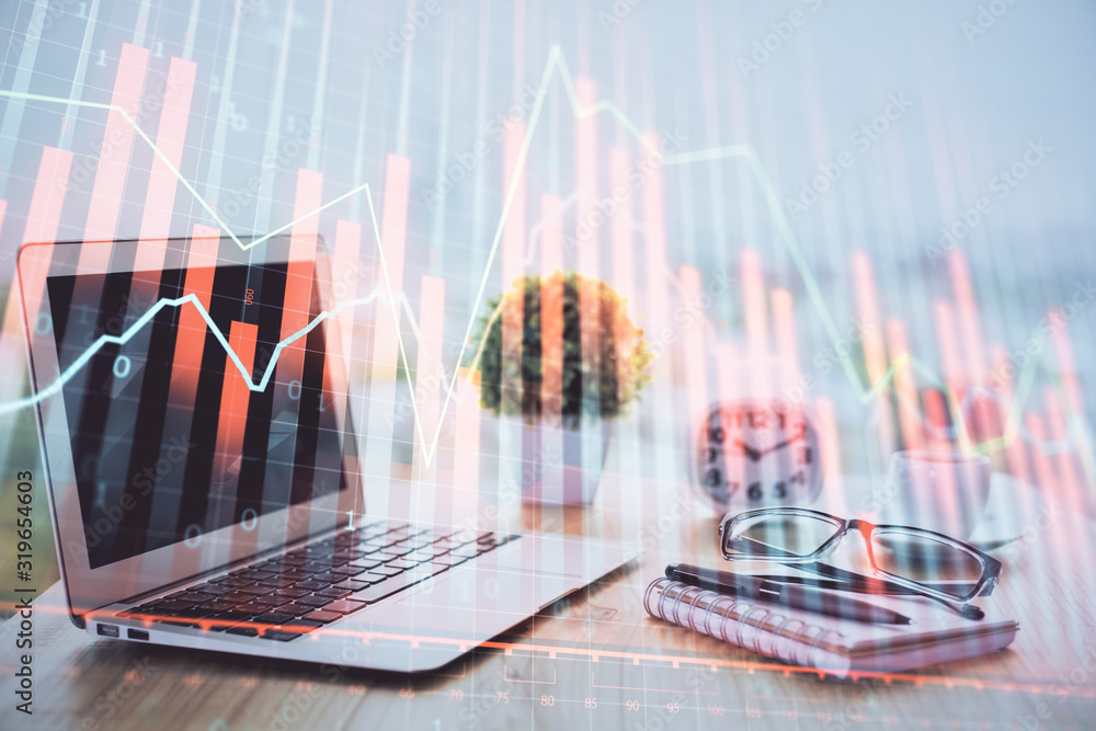 Forex graph hologram on table with computer background. Multi exposure. Concept of financial markets. Forex graph hologram on table with computer background. Multi exposure. Concept of financial markets.