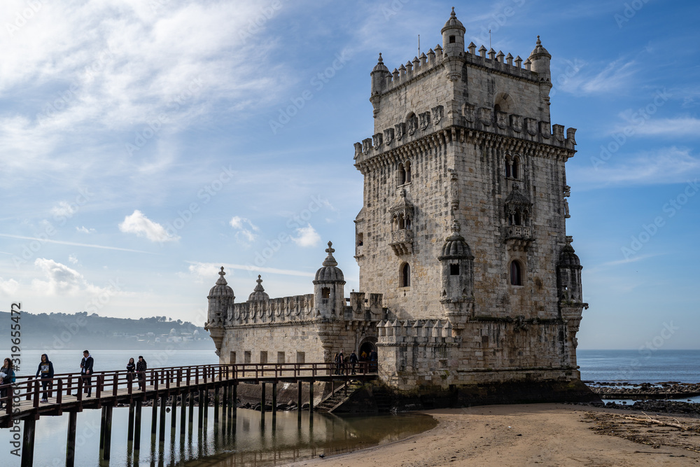 Lisbon, Portugal - Tourists visit Belem Tower, a UNESCO World Heritage Site and fort