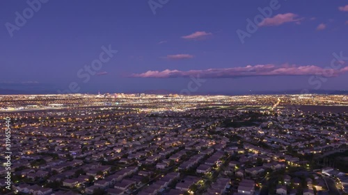 Las Vegas Skyline in Evening Twilight. Nevada, USA. Aerial Hyper Lapse, Time Lapse. Drone Flies Sideways