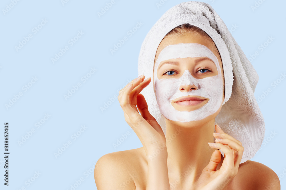 © Olesia - Cosmetology, skin care, face treatment, spa and natural beauty concept. Woman with facial mask.