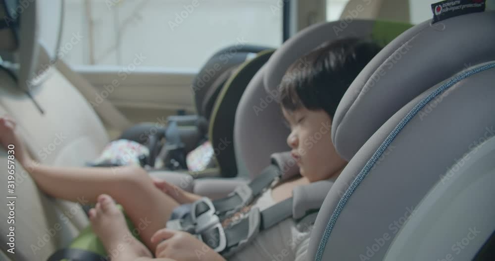 Kids asleep in the car seat in day time Kids asleep in the car seat in day time