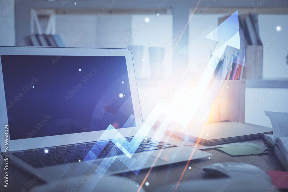 Computer on desktop with point up arrows hologram. Double exposure. Concept of success. Computer on desktop with point up arrows hologram. Double exposure. Concept of success.