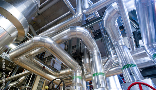 Equipment, cables and piping as found inside of a modern industrial power plant