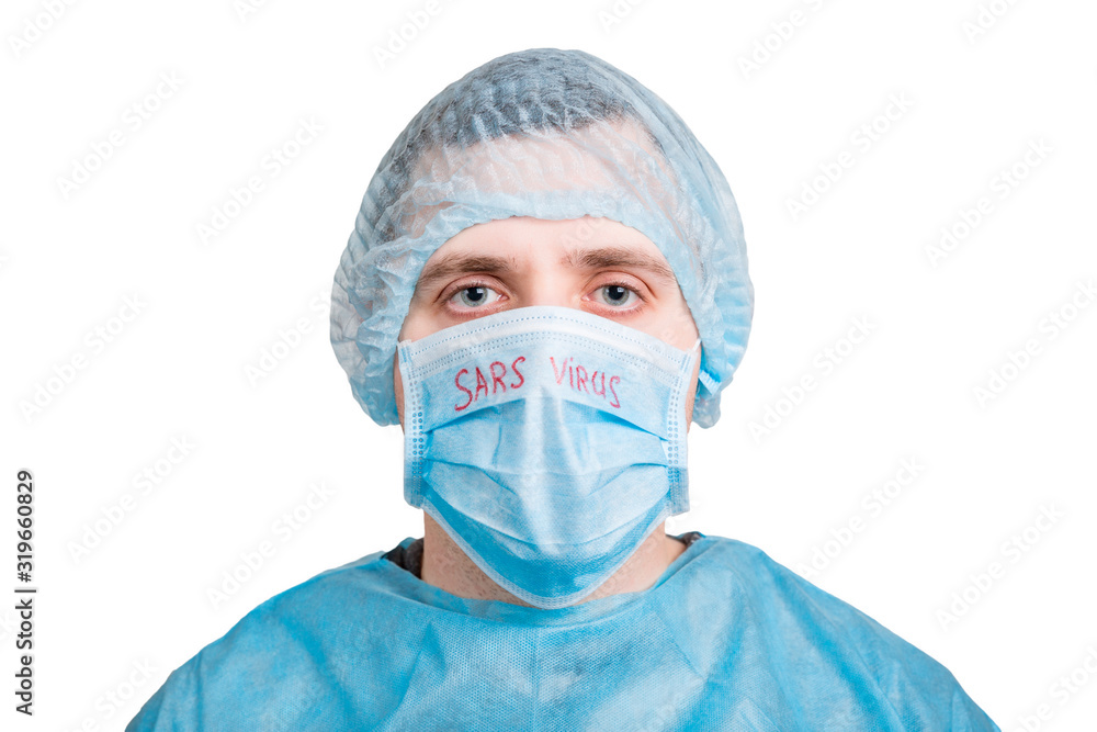 Portrait of handsome man wearing medical uniform and mask with SARS virus word isolated on white background. Protect your health. Coronavirus concept Portrait of handsome man wearing medical uniform and mask with SARS virus word isolated on white background. Protect your health. Coronavirus concept