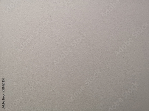 Cream color painting of polished surface on concrete plastering background