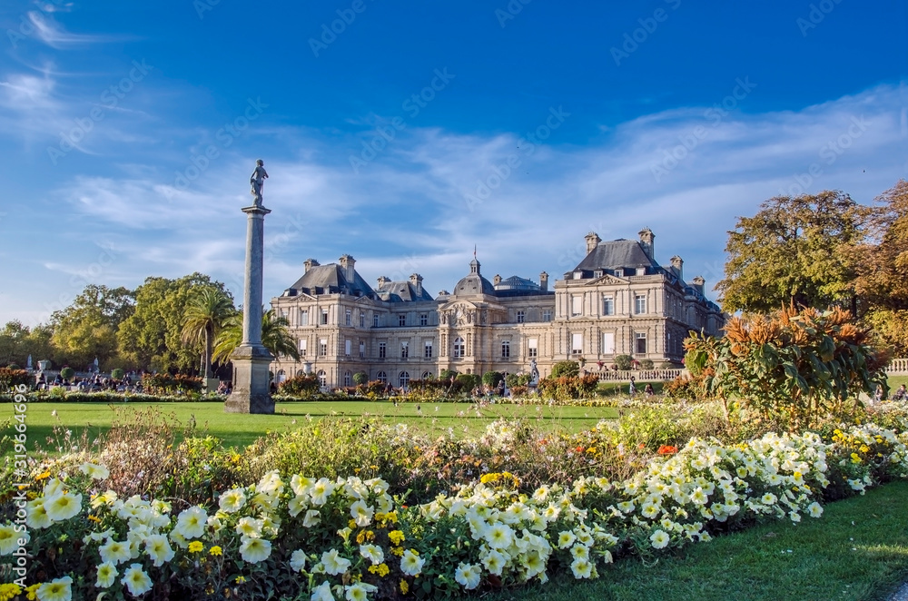 Luxembourg Palace And Garden at day with blue sky and flowers, Paris, France