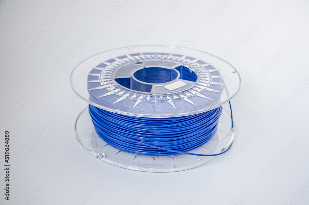 Plastic for 3D printing. Blue plastic filament, red ABS/PLA coil for 3d printer on white background, isolated - obrazy, fototapety, plakaty 