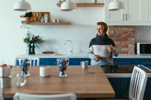 Woman drinking coffee in the kitchen