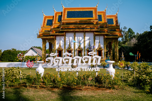 Khuk Khak Temple ,Khao Lak Thailand, Buddhist temple Khuek Khak Temple on a sunny day photo