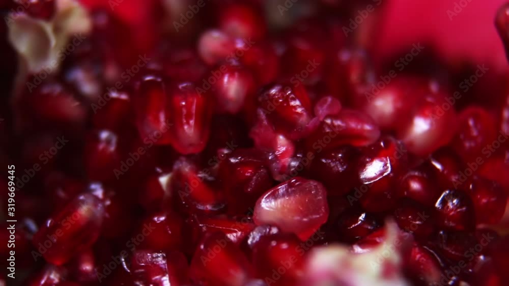 ripe pomegranate fruit with bright maroon grains. Garnet color. Rotation video ripe pomegranate fruit with bright maroon grains. Garnet color. Rotation video