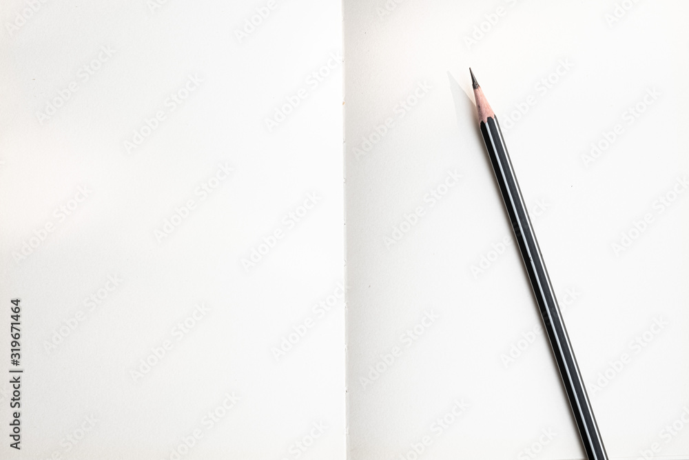 The top image of the white paper spiral notebook and pencil is separate. The top image of the white paper spiral notebook and pencil is separate.