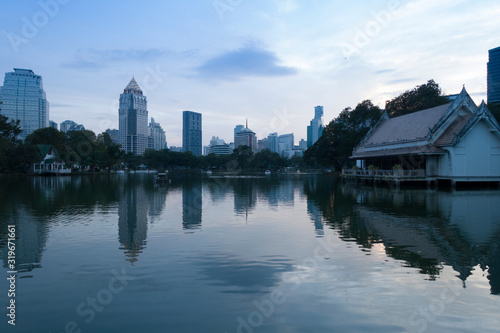 City scape view from the Lumphini Park in Bangkok at dusk.