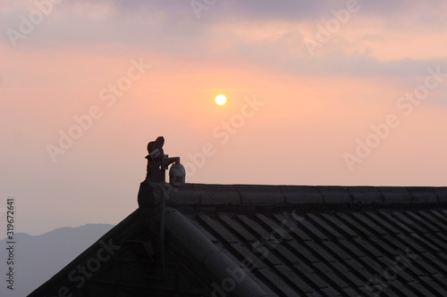 sunrise over a roof © eminda